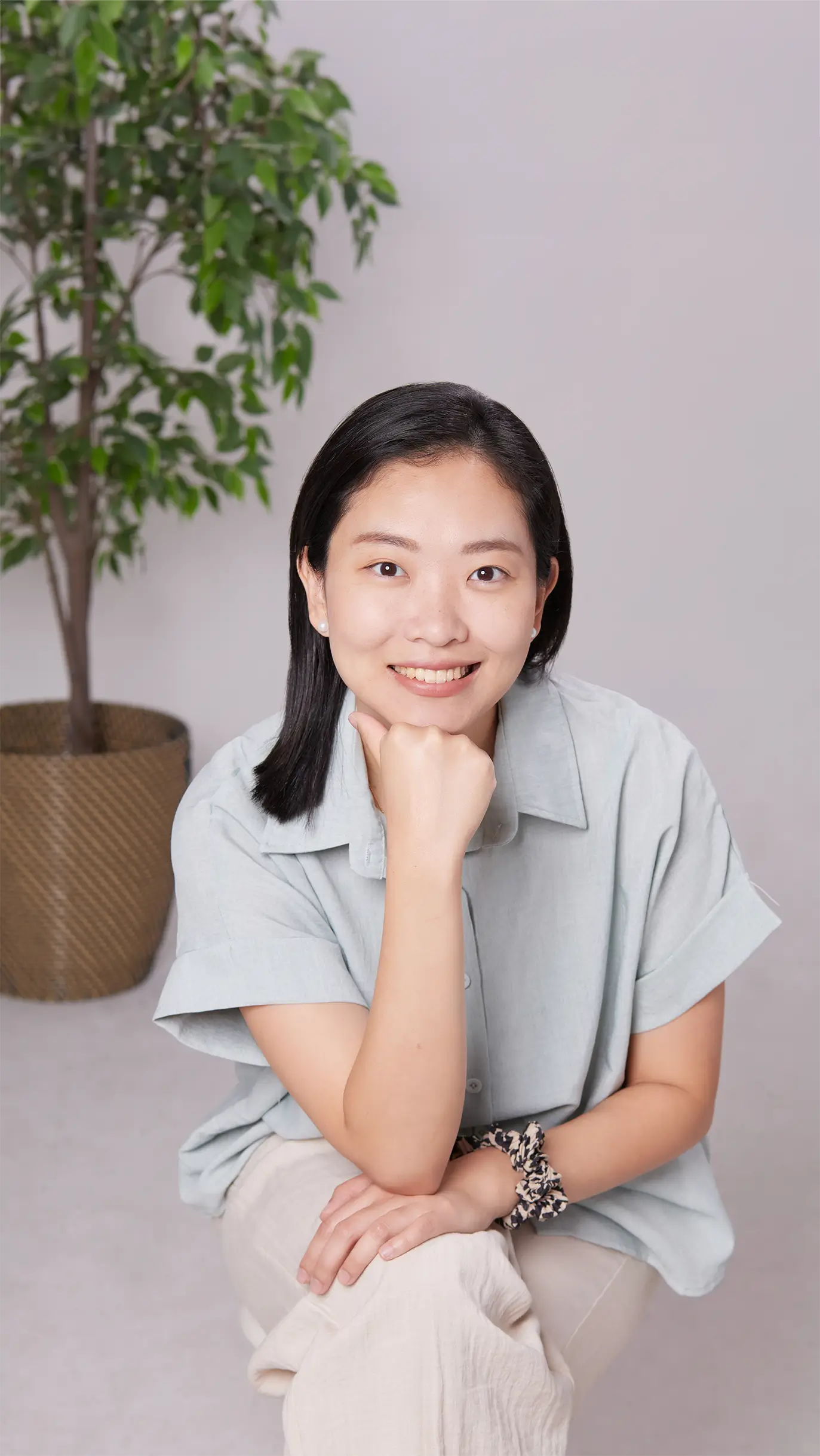Dr Michelle Chee looking towards in a compassionate demeanour
